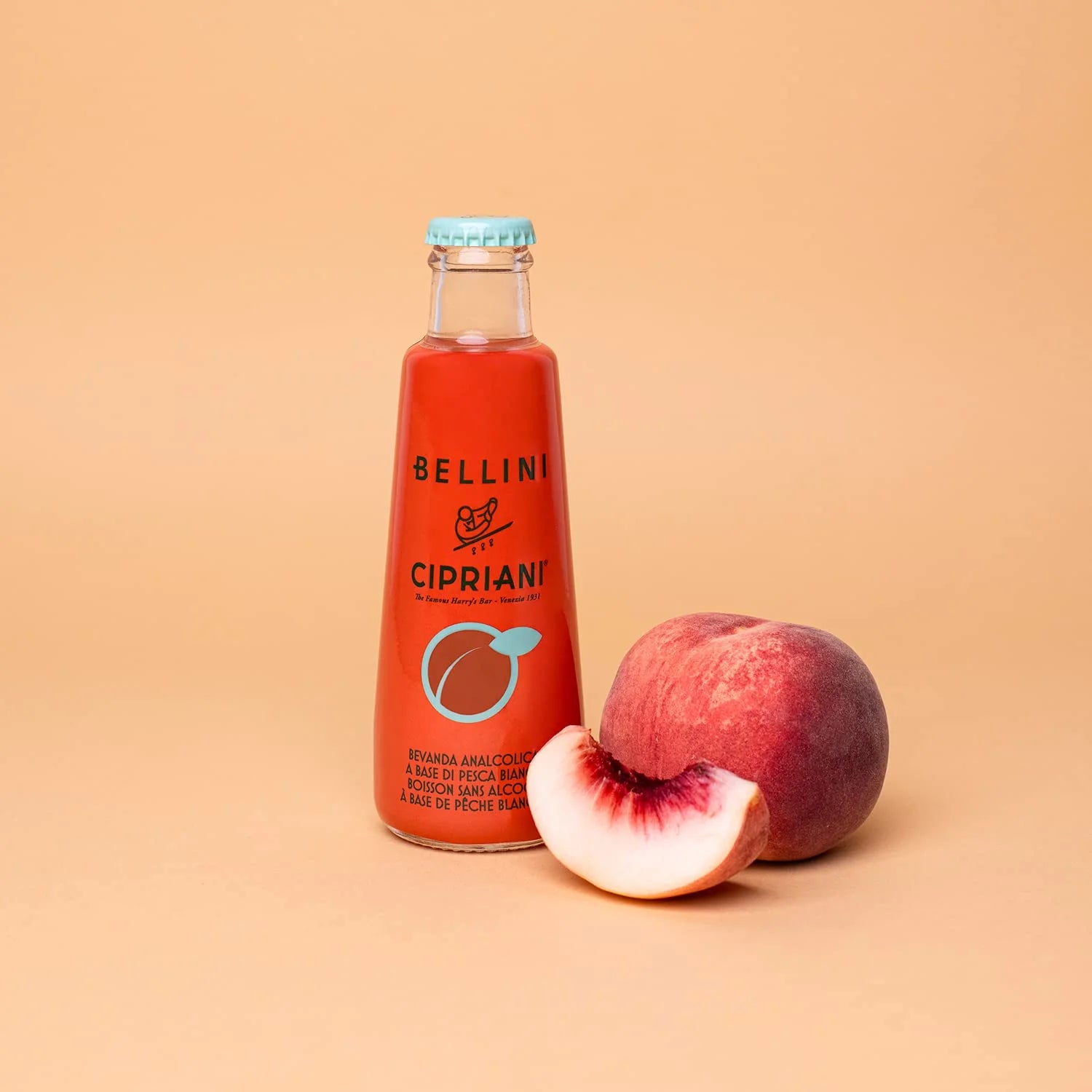 Cipriani White Peach Virgin Bellini non-alcoholic cocktail mixer bottle with peach and slice