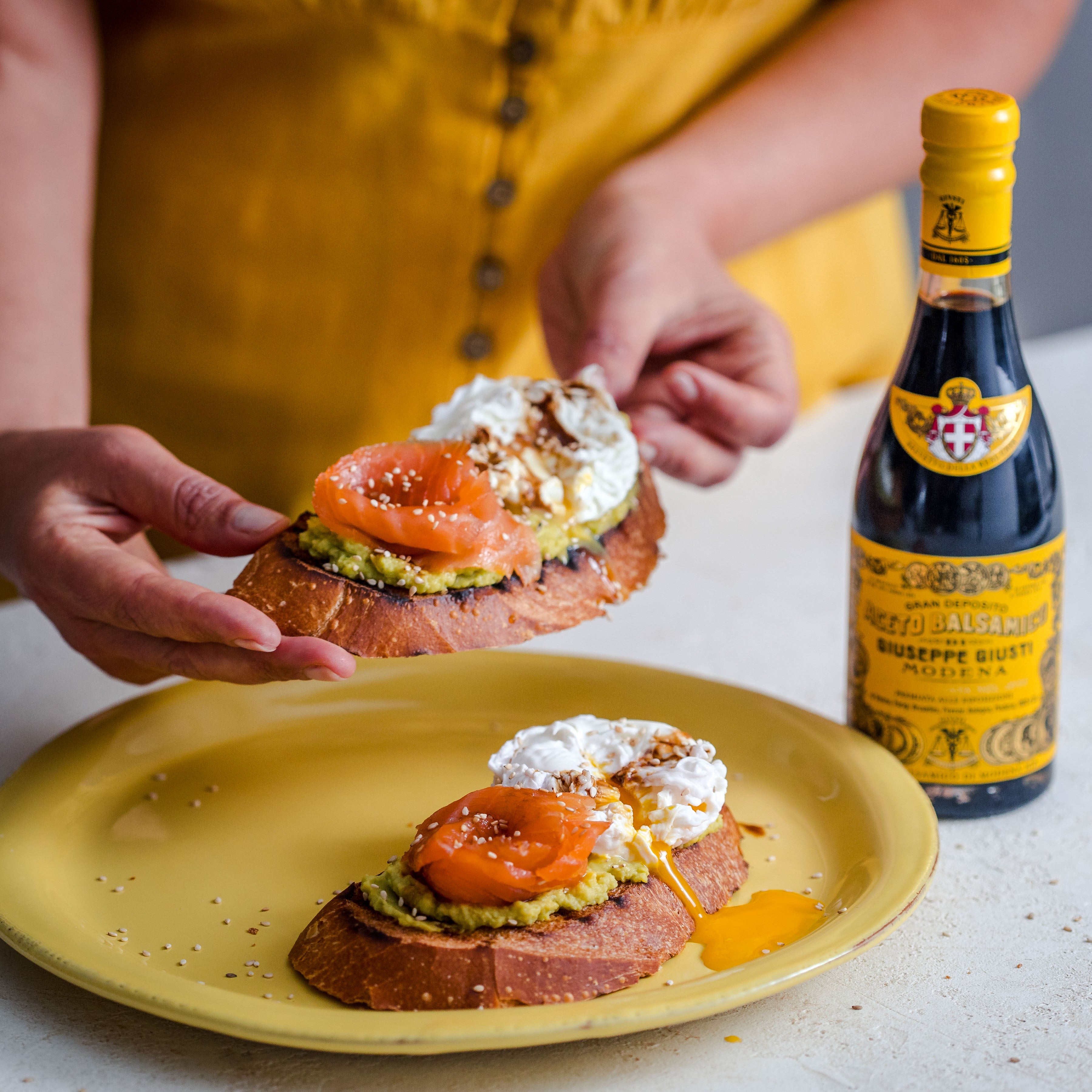 Bruschetta with Avocado, Smoked Salmon, Soft Egg, and Balsamic Vinegar of Modena