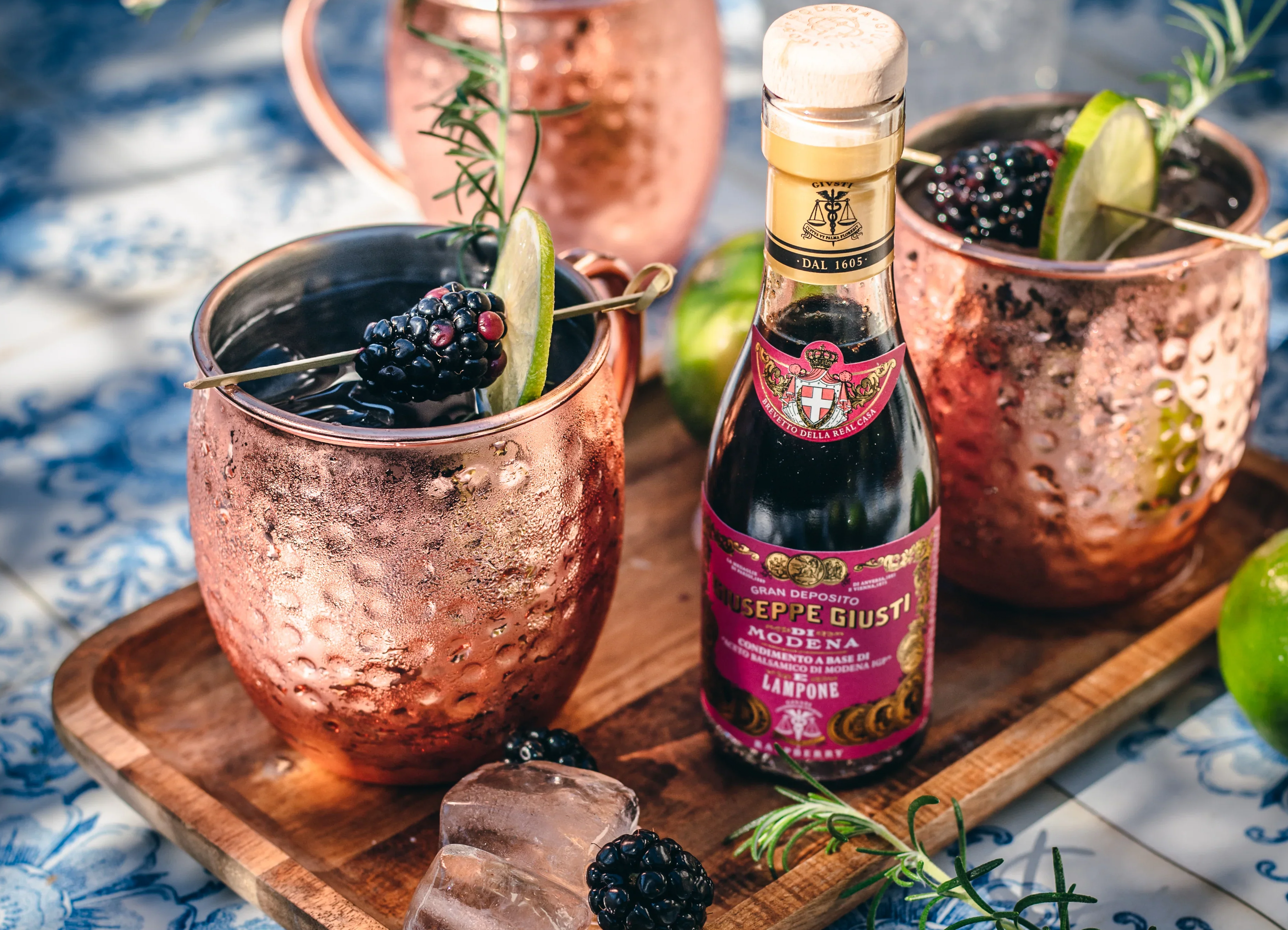 Elegant Memorial Day cocktail setup featuring Giusti Flavored Balsamic Vinegar Gift Set with fresh ingredients and Italian-inspired deco