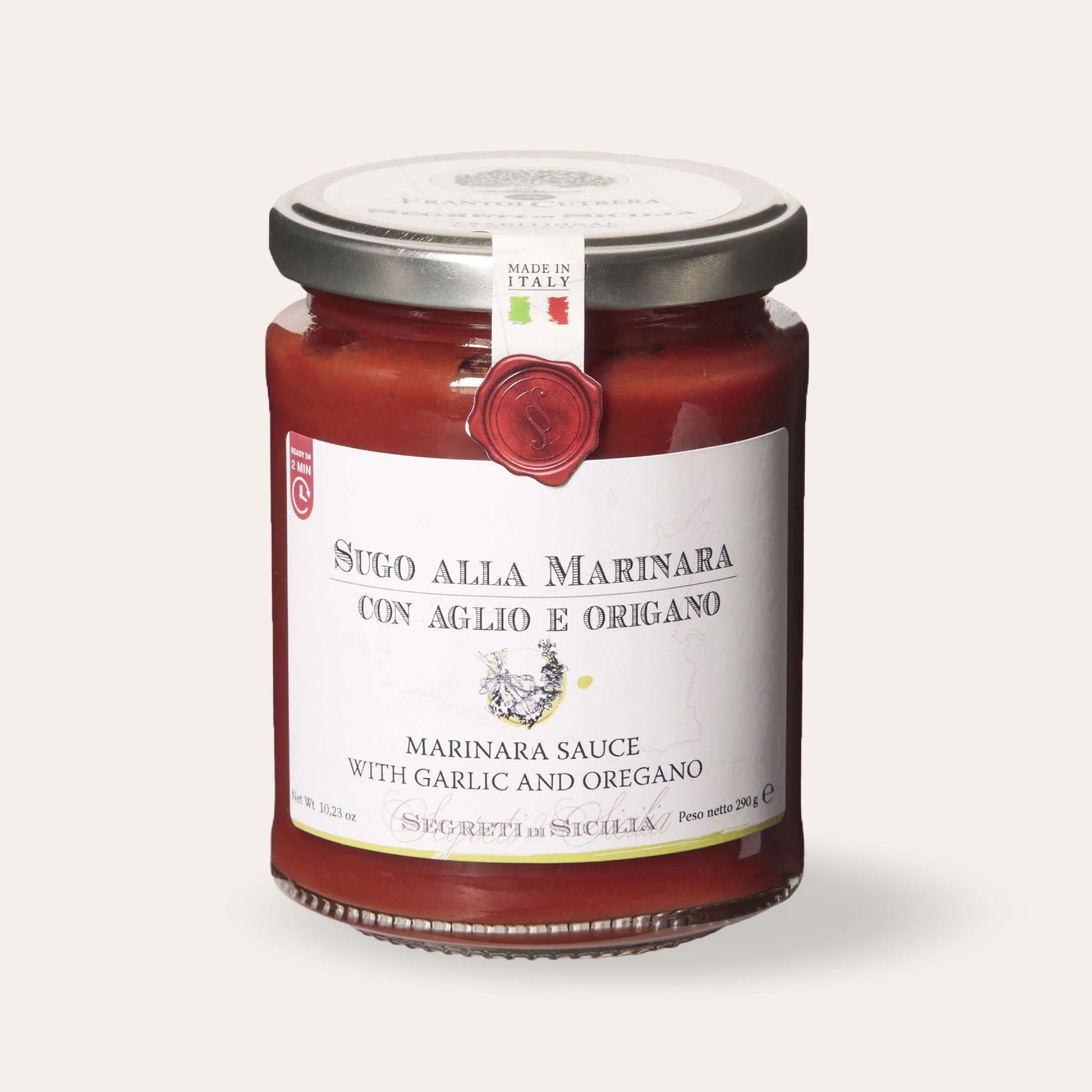 Jar of Sicilian marinara sauce with garlic and oregano on beige background
