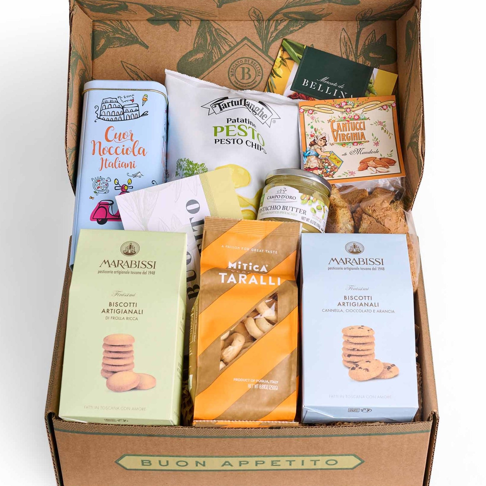 A curated gourmet gift box from Buon Appetito, filled with various Italian snacks, biscuits, and packaged foods, photographed from a top-down perspective on a clean white background.