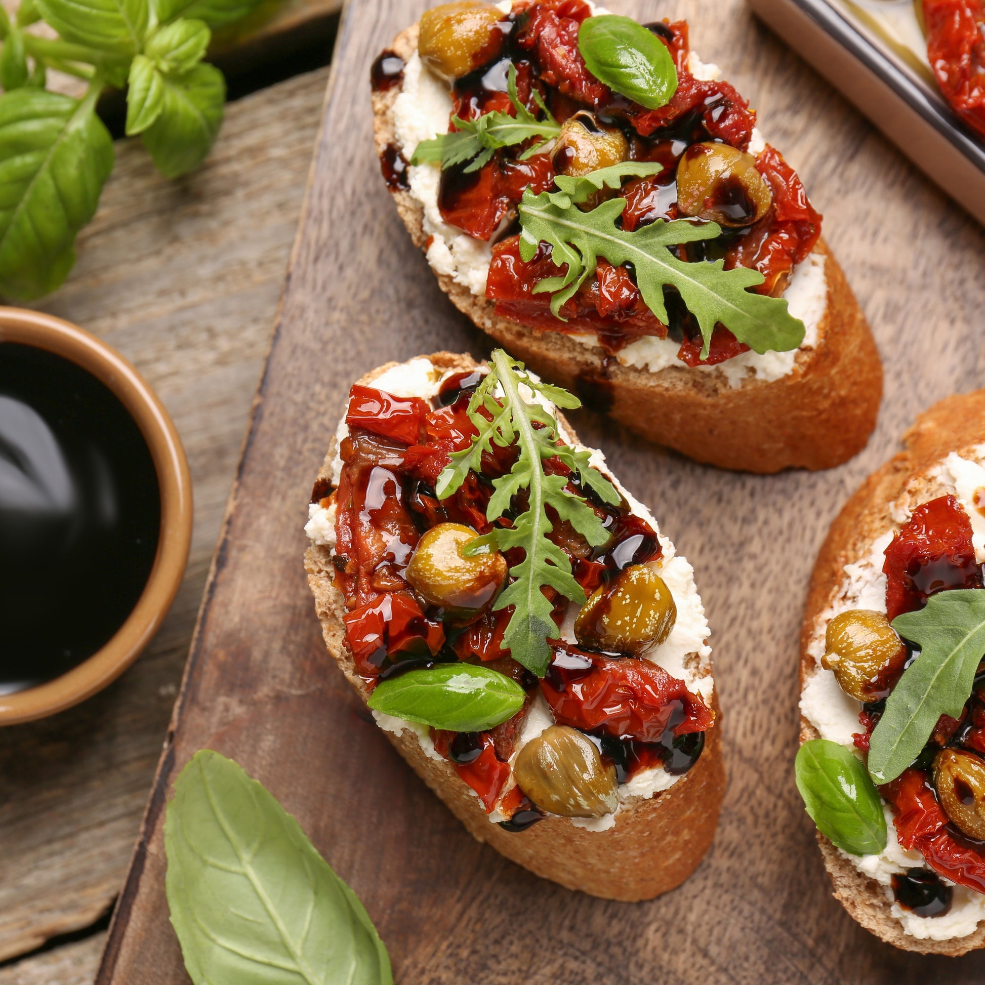 Toasted bread with sun-dried tomatoes, ricotta, and Giusti Organic Balsamic Vinegar