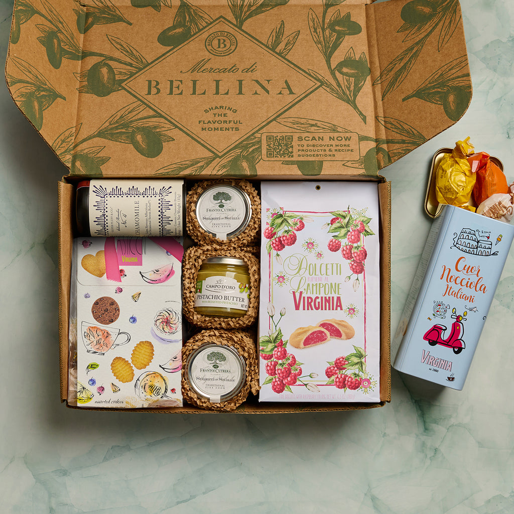 Open La Dolce Vita gift box filled with cookies, pistachio butter, tea, and Italian sweets