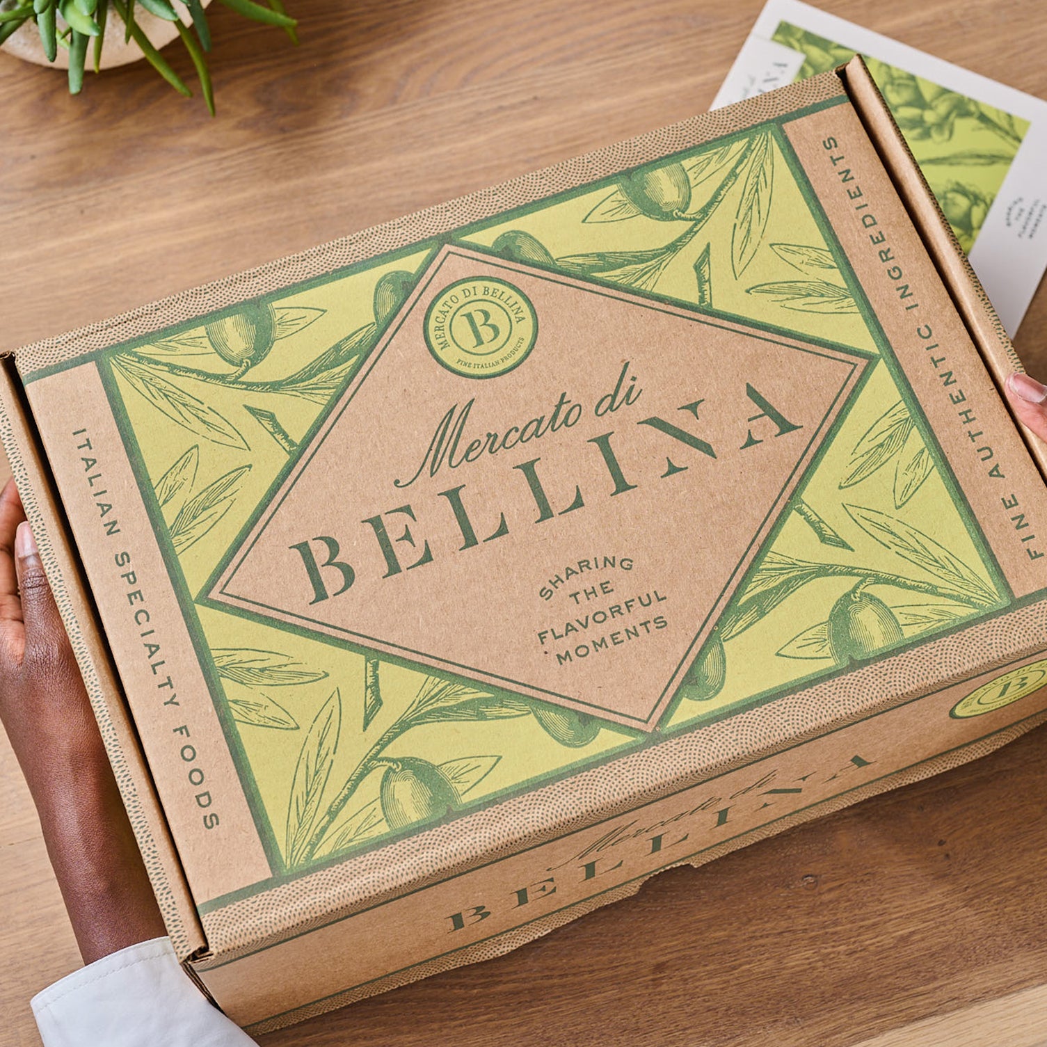 Mercato di Bellina branded gift box packaging with green olive leaf design