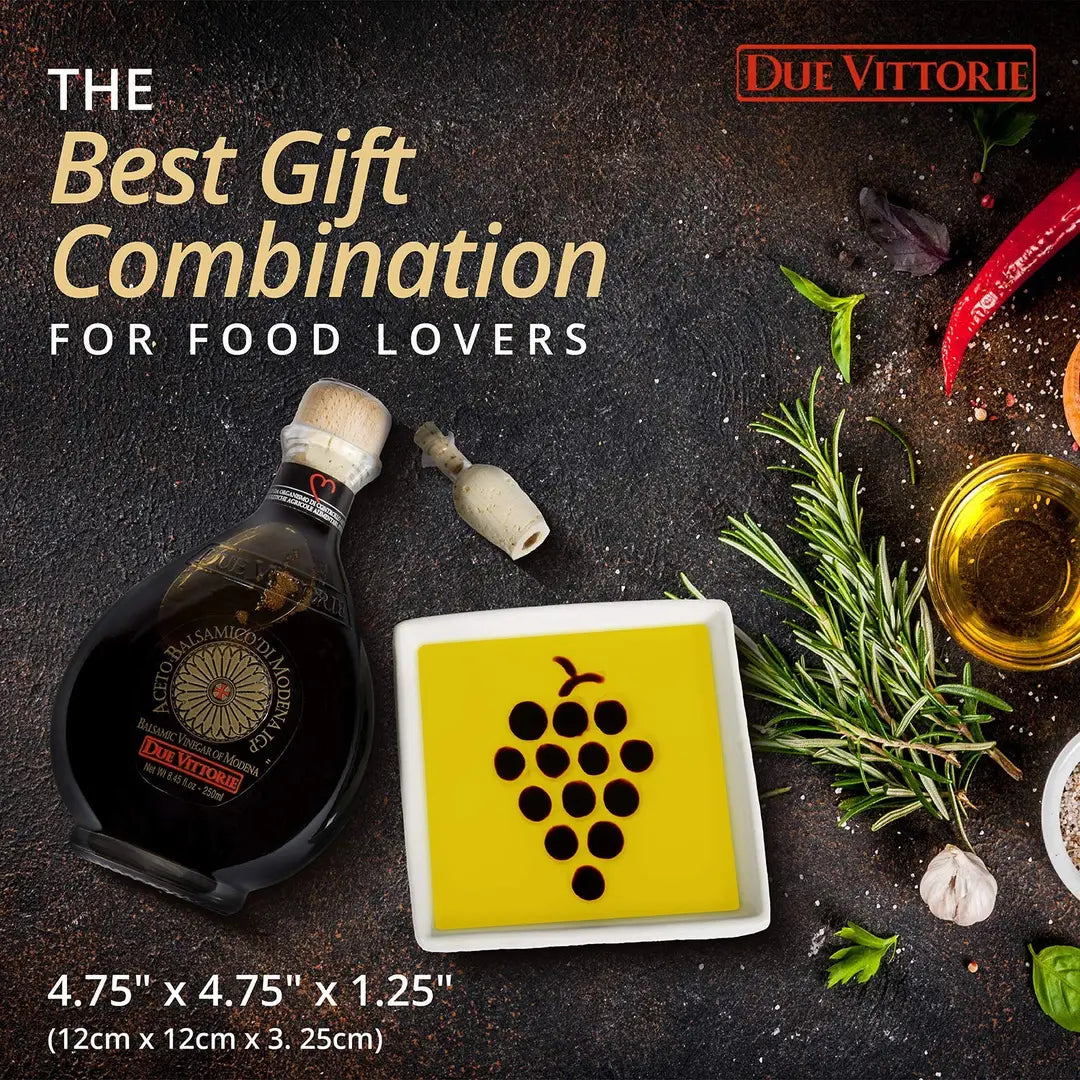 Promotional image of a bottle of Due Vittorie balsamic vinegar with a decorative coaster on a dark surface.