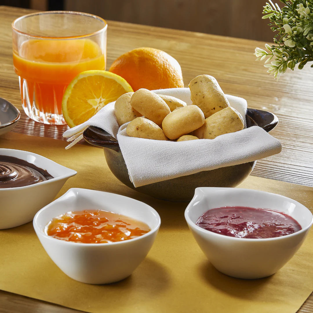 Bowl of Imacoritti Grissini Bites mini breadsticks served with jam and chocolate dips